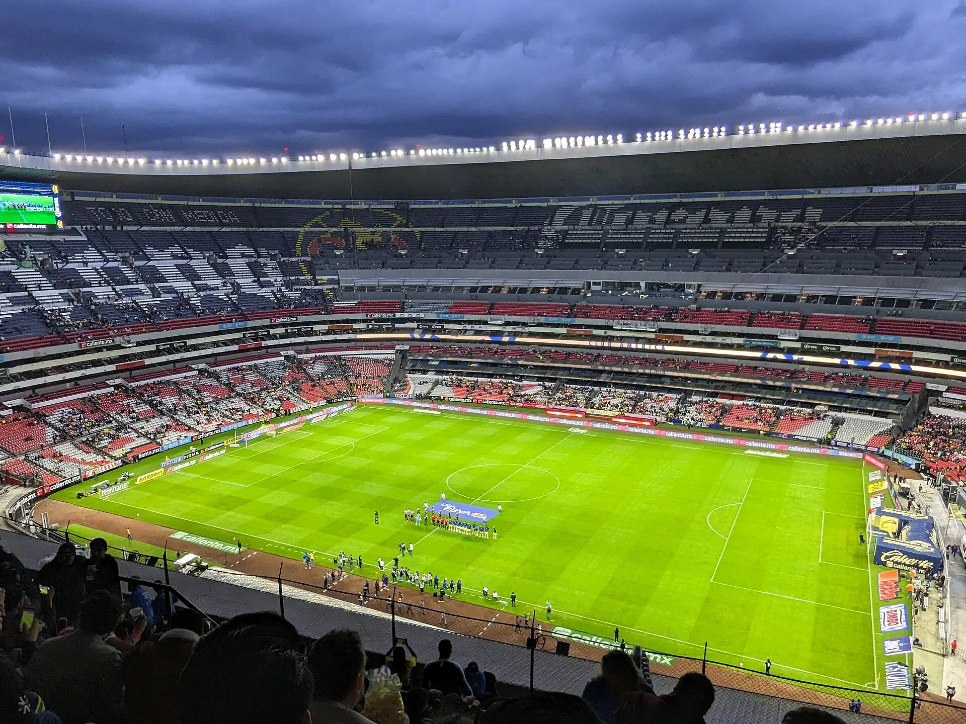 can i use this image: how bout photos like this: can i use this photo for the blog? can i use this? English: The teams line up for Club América vs. Club Necaxa in the Apertura stage of Liga MX at the Aztecs Stadium in Mexico City on 23 August 2023. Date 23 August 2023, 18:57:09 Source Own work Author FromMorningToMidnight Licensing I, the copyright holder of this work, hereby publish it under the following license: Creative Commons CC-Zero This file is made available under the Creative Commons CC0 1.0 Universal Public Domain Dedication. The person who associated a work with this deed has dedicated the work to the public domain by waiving all of their rights to the work worldwide under copyright law, including all related and neighboring rights, to the extent allowed by law. You can copy, modify, distribute and perform the work, even for commercial purposes, all without asking permission. SEO TITLE: Liga MX Pick'em: Rules for the Apertura, Clausura, and Liguilla H1 TITLE: Liga MX Pick'em: How to Set It Up for the Apertura, Clausura, and Liguilla SLUG: liga-mx-pickem-apertura-clausura-liguilla META DESCRIPTION: Learn how to set up a Liga MX pick'em pool, including regular season scoring, Liguilla rules, and the 2026 format change that eliminated the Play-In. PRIMARY KEYWORD: Liga MX pick'em SECONDARY KEYWORDS: Mexican football pick'em CLUSTER: Progol–Pick'em WORD COUNT: 1,535 SUGGESTED FEATURED IMAGE: Liga MX standings alongside a pick'em sheet with match predictions filled in. ALT TEXT: Liga MX pick'em sheet with regular season and Liguilla predictions. INTERNAL LINKS USED: "the guide on how to create a pick'em pool" → https://tribunacentral.com/como-hacer-una-quiniela-guia-para-la-oficina-con-amigos-y-con-progol/ "the guide on what Progol is and how to play" → https://tribunacentral.com/que-es-progol-y-como-se-juega-la-guia-completa/ EXTERNAL SOURCES: https://www.tudn.com/futbol/liga-mx/hay-play-in-o-repechaje-en-la-liga-mx-apertura-2026 https://espndeportes.espn.com/futbol/mexico/nota/_/id/15988448/liga-mx-play-in-clausura-2026-desaparece-mundial https://www.dazn.com/es-MX/news/f%C3%BAtbol/liguilla-liga-mx-equipos-clasificados-emparejamientos-play-in/6gawtou25o2i1eugpll5yukvz whats the alt text for the photo above For the Estadio Azteca wide-angle photo of Club América vs. Club Necaxa, the alt text should describe exactly what's visible. Here are the best options: Best (recommended) Players line up before a Liga MX Apertura match at Estadio Azteca. ✅ Alternatives Wide view of Estadio Azteca before a Liga MX match. Teams line up on the pitch before a Liga MX Apertura match at Estadio Azteca. Panoramic view of Estadio Azteca during a Liga MX Apertura matchday. Club América and Club Necaxa line up before a Liga MX match at Estadio Azteca. (Use this only if you're comfortable naming the teams.) For your article about Liga MX pick'em (quiniela), I'd use: Players line up before a Liga MX Apertura match at Estadio Azteca. It's accurate, concise, and relevant without overstating the image's connection to the article. in spanish: Wide view of Estadio Azteca before a Liga MX match. Vista panorámica del Estadio Azteca antes de un partido de la Liga MX